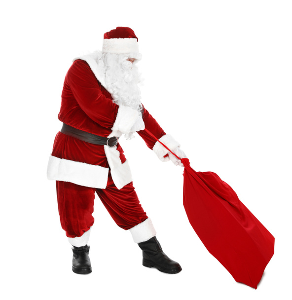 Authentic Santa Claus with bag full of gifts on white background - Photo, Image