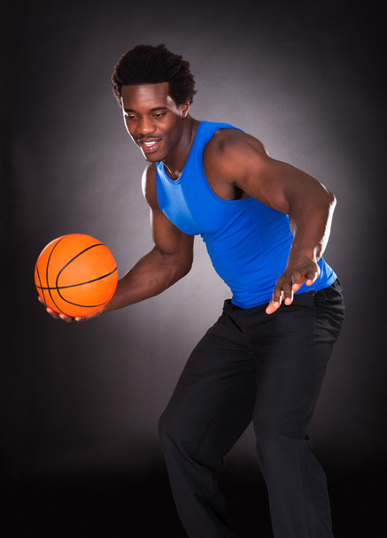 African Man Carrying Basketball - Photo, image