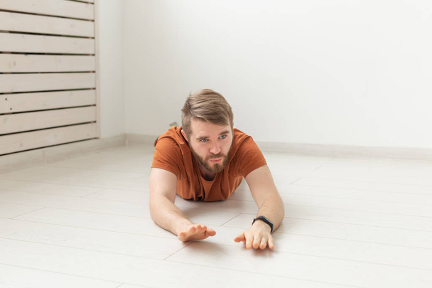 Relaxed and casual young man relaxing on the floor - Photo, Image