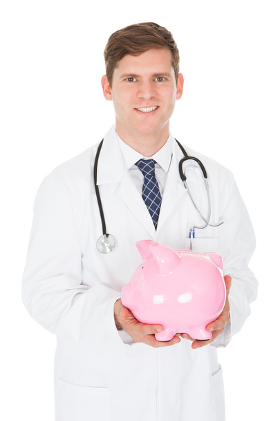 Male Doctor With Piggy Bank - Photo, image