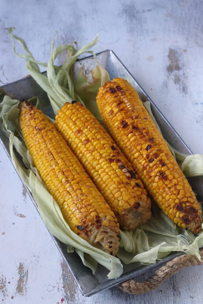 Roasted corns with cobs ,cooked corns - 写真・画像