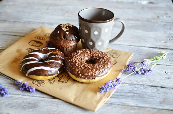 Morning, Provence style breakfast, tea, chocolate donuts and muffin. - Photo, Image