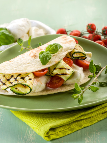 piadina with mozzarella, grelled zucchinis and tomatoes, typica - Fotó, kép