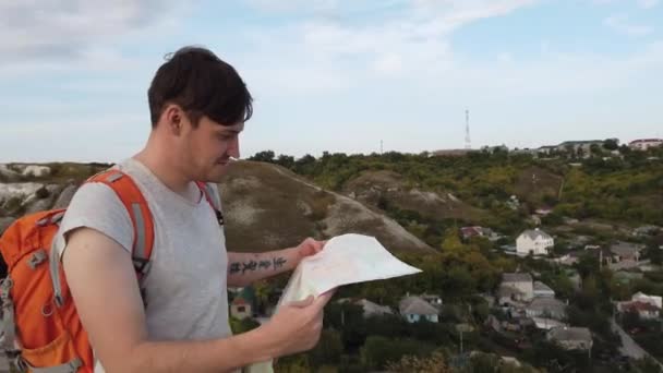 A traveling man with map  - Felvétel, videó