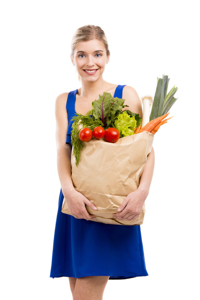 Beautiful woman carrying vegetables - Fotografie, Obrázek