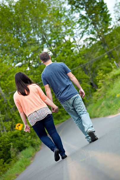Man and Woman Walking in Street - Photo, Image