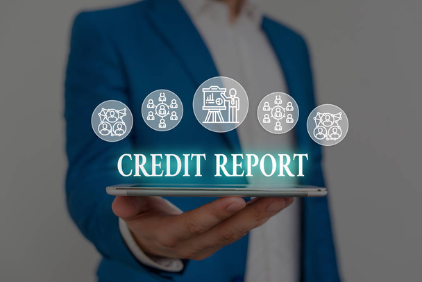 Text sign showing Credit Report. Conceptual photo Borrowing Rap Sheet Bill and Dues Payment Score Debt History Male human wear formal work suit presenting presentation using smart device. - 写真・画像