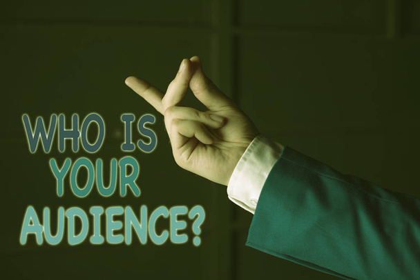 Text sign showing Who Is Your Audience Question. Conceptual photo who is watching or listening to it Isolated hand pointing with finger. Business concept pointing finger. - Photo, Image