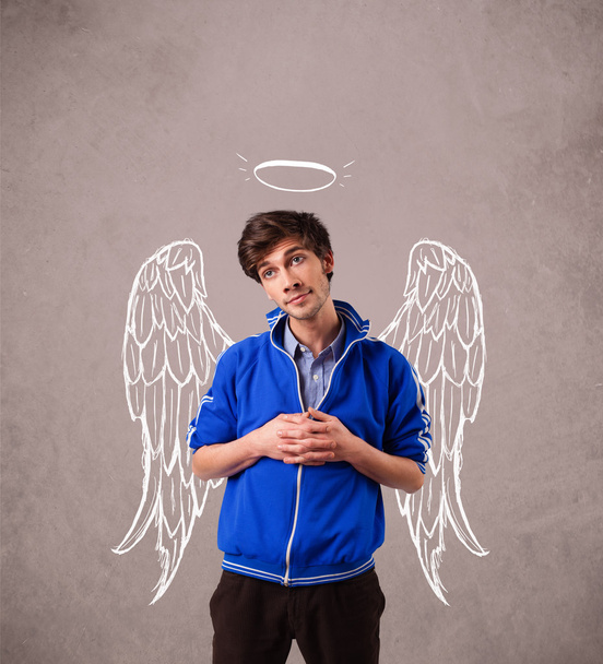 Young man with angel illustrated wings - 写真・画像