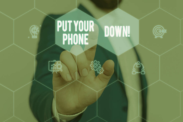 Text sign showing Put Your Phone Down. Conceptual photo end telephone connection saying goodbye caller Male human wear formal work suit presenting presentation using smart device. - Photo, Image