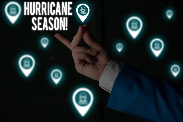 Text sign showing Hurricane Season. Conceptual photo time when most tropical cyclones are expected to develop Male human wear formal work suit presenting presentation using smart device. - Photo, Image