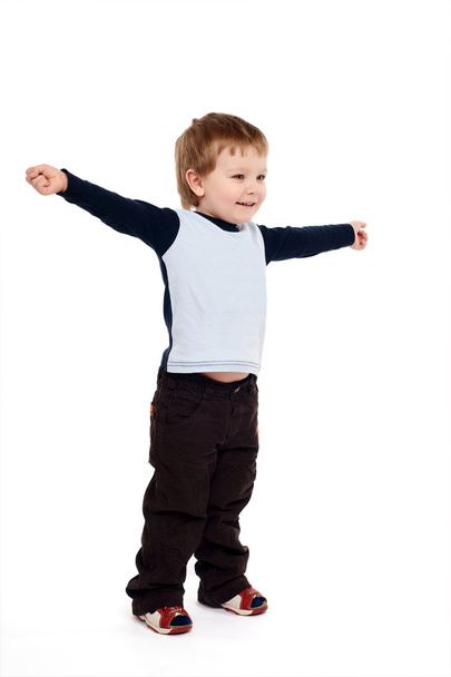 Portrait of joyful boy with raised arms - Фото, изображение