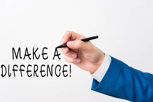 Text sign showing Make A Difference. Conceptual photo have significant effect or non on demonstrating or situation Isolated hand above white background. Pointing pen in the hand on white background. - Photo, Image