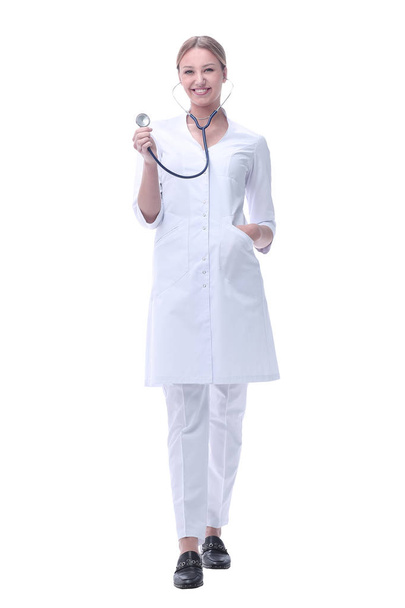 smiling woman doctor showing her stethoscope. isolated on white - Foto, imagen