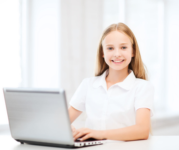 Girl with laptop pc at school - Foto, Bild