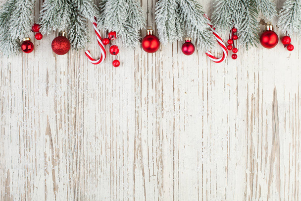Beautiful Christmas composition border on white wooden background - Foto, Bild