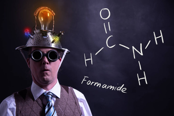 Nerd presenting handdrawn chemical formula of Formamide - Photo, Image