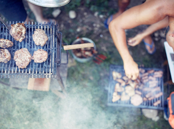 Barbecue making outdoors on a regular / vintage grill. - 写真・画像
