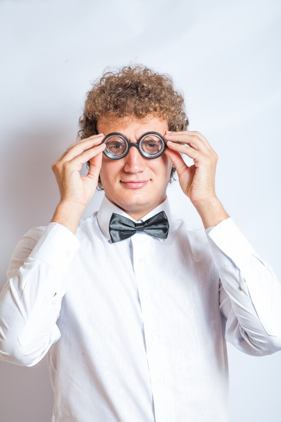 Handsome young man in nerd glasses studio shot on gray background - Fotoğraf, Görsel