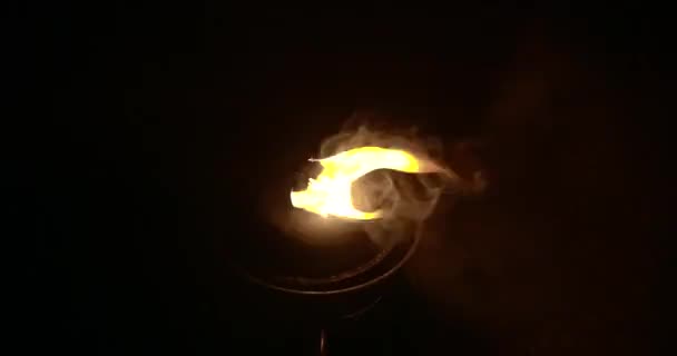 Torch fire on a black background in slow motion - Materiał filmowy, wideo