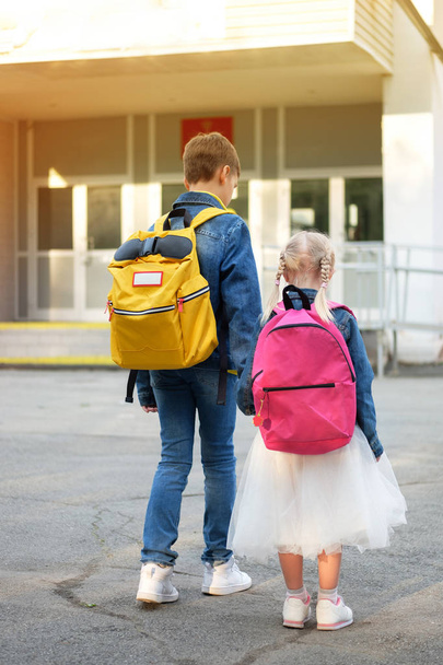 Boy with girl hold hand run to school - Valokuva, kuva