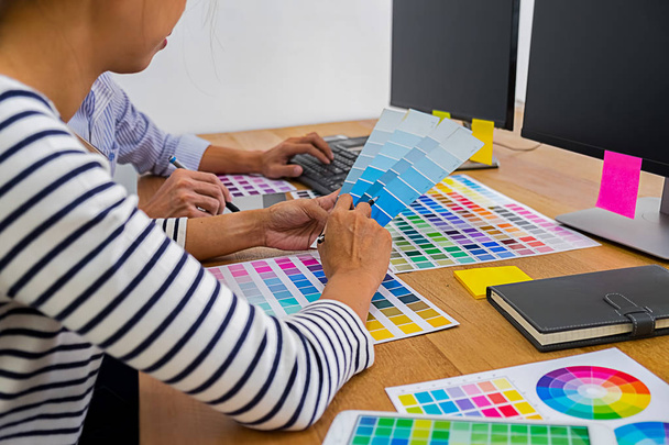 Graphic design with color swatches and tablet on a desk. Graphic - Photo, Image