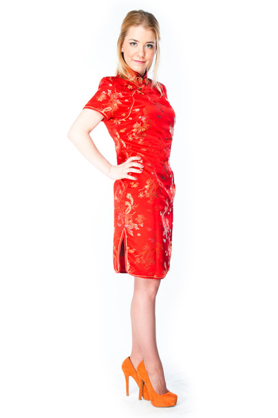 Woman in a red Chinese dress - 写真・画像