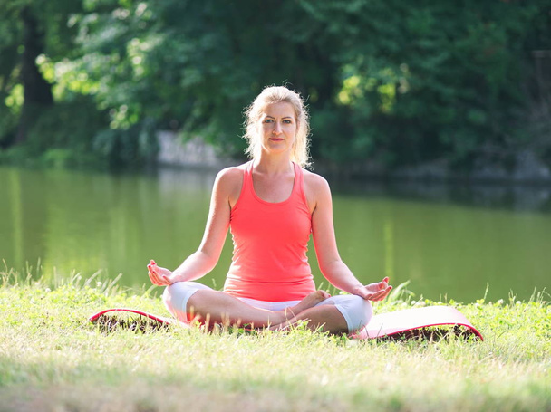Woman Doing Yoga in the Park - Photo, Image