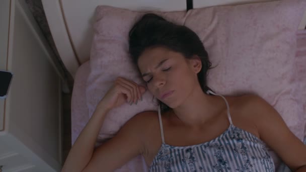 girl wakes up in bed - Felvétel, videó