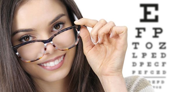 eye examination, woman smiling with spectacles isolated in optic - Photo, Image