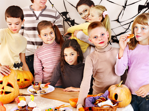 Halloween party with children holding trick or treat. - Photo, Image