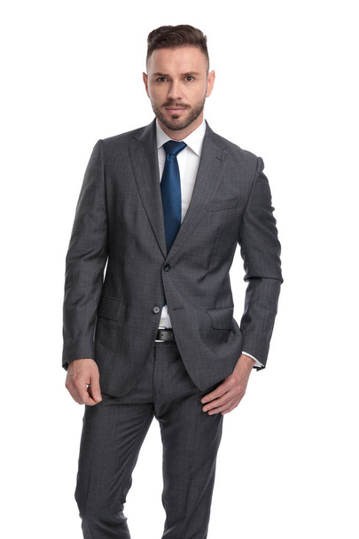 young handsome businessman standing with one hand in pocket - Foto, Imagen