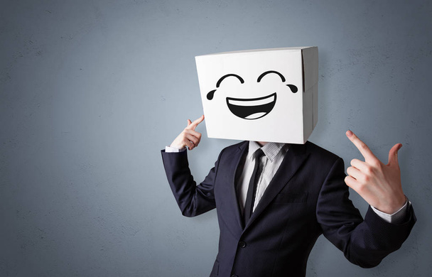 Funny man smiling with cardboard box head - Fotó, kép