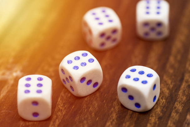 Five dice with the number 6 on a wooden table. Five dice shows the six, what a luck - Photo, Image