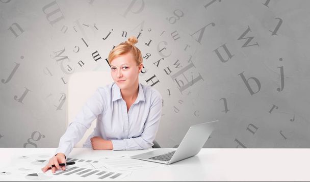 Business person sitting at desk with editorial concept - Zdjęcie, obraz