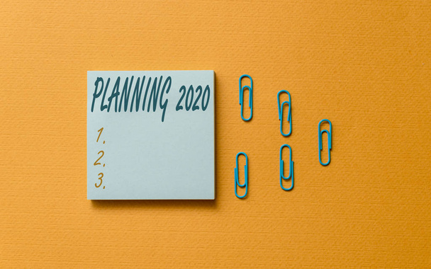 Writing note showing Planning 2020. Business photo showcasing Begin with end in the Mind Positioning Long term Objectives Colored blank sticky note clips gathered trendy cool pastel background. - Photo, Image