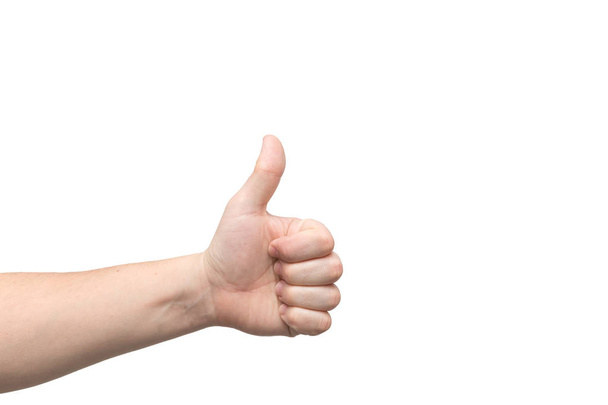 Closeup of male hand showing thumbs up sign - Photo, Image