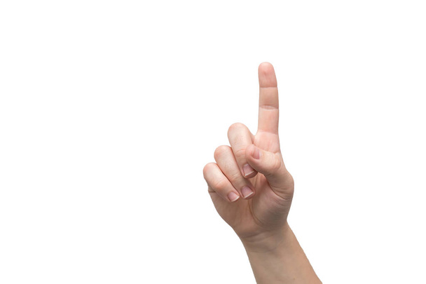 O dedo indicador de uma mão masculina está apontando para cima isolado em um fundo branco. Sinal de atenção. O número um na contagem.
. - Foto, Imagem