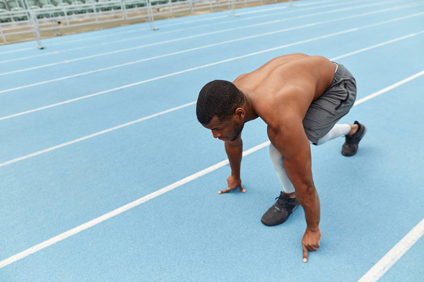 sporty ambitious guy doing exercises for legs - Foto, Bild