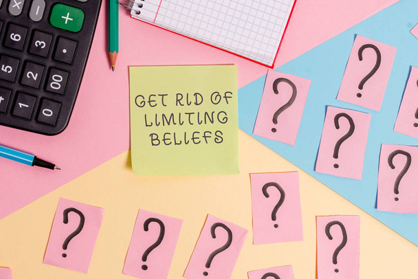Conceptual hand writing showing Get Rid Of Limiting Beliefs. Business photo text remove negative beliefs and think positively Mathematics stuff and writing equipment on pastel background. - Photo, Image