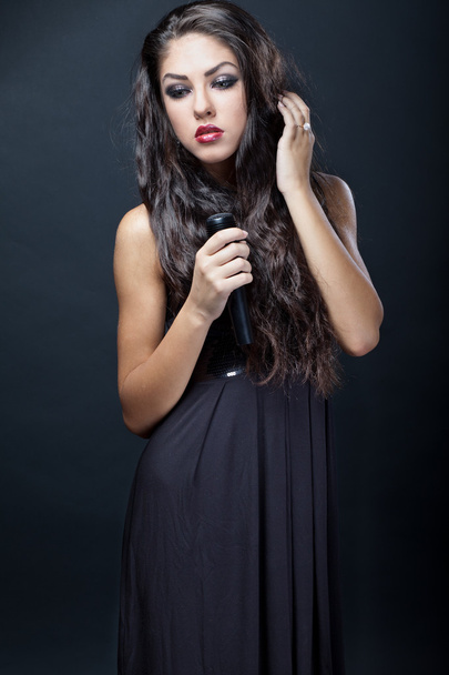 Beautiful young woman singer - Foto, Imagen