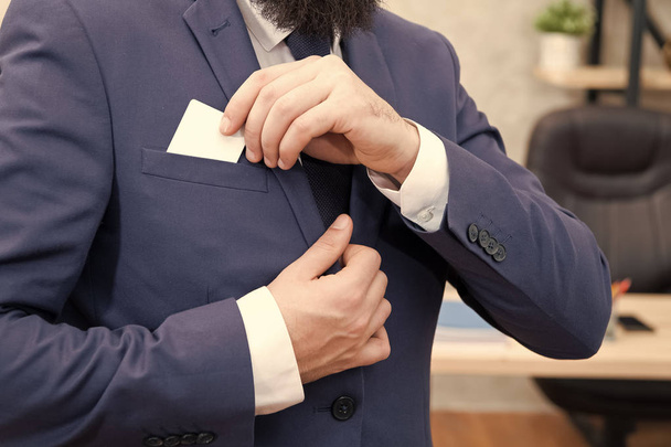 Business card. Businessman put card in business suit. Man. Modern businessman. Male fashion. Man with credit card. take out copy space in pocket. Here is my business card. Business suit dress code - 写真・画像