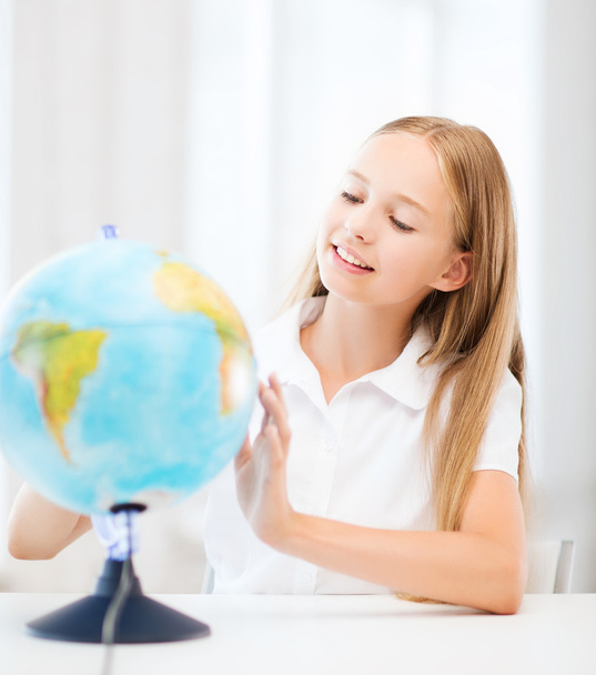 Student girl with globe at school - Φωτογραφία, εικόνα