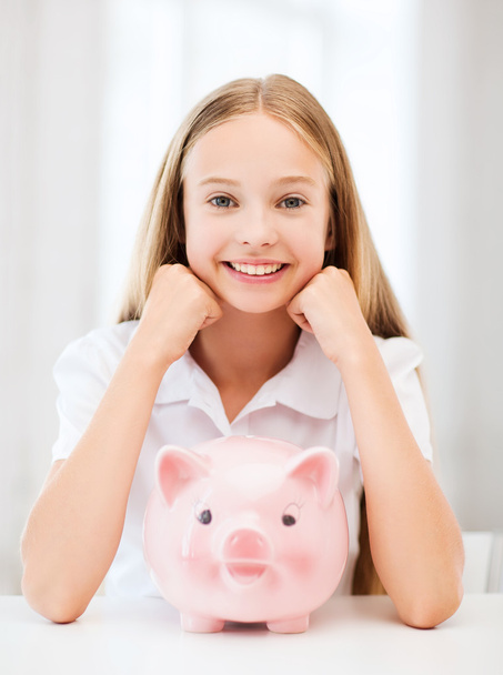 Child with piggy bank - Фото, изображение