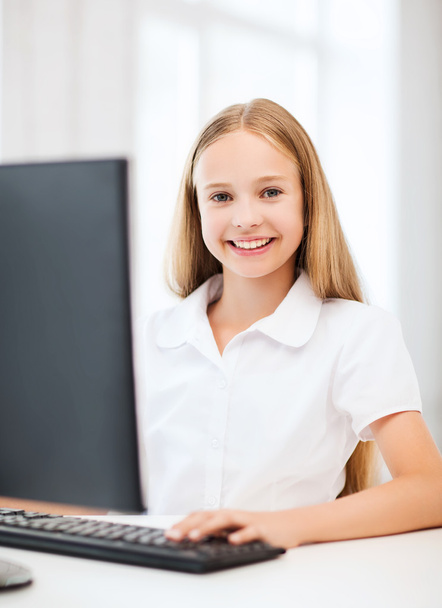 Student girl with computer at school - Фото, зображення