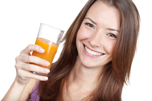 Beautiful brunette woman holding glass of juice - Fotó, kép