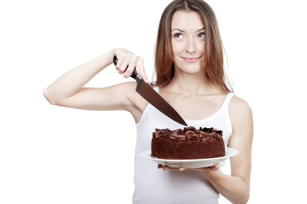 Young woman is going to cut a piece of cake - Foto, imagen