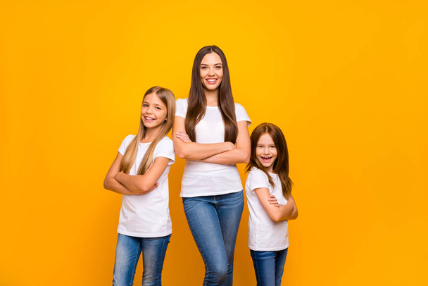 Photo of three sister ladies self-confident crossing arms wear casual outfit isolated yellow background - Foto, afbeelding
