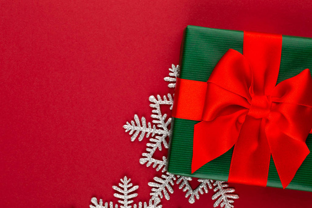 Christmas, holiday present box on red background. - Zdjęcie, obraz