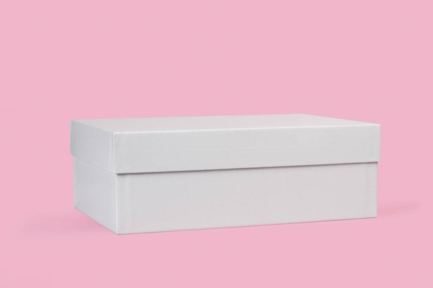 A white shoes box on a pink background - Photo, Image